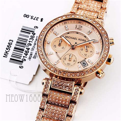 Reloj michael kors dorado con piedras .